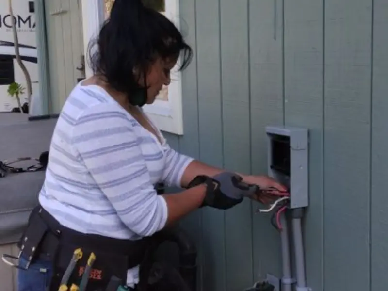 Licensed electrician wiring an exterior subpanel in Waconia
