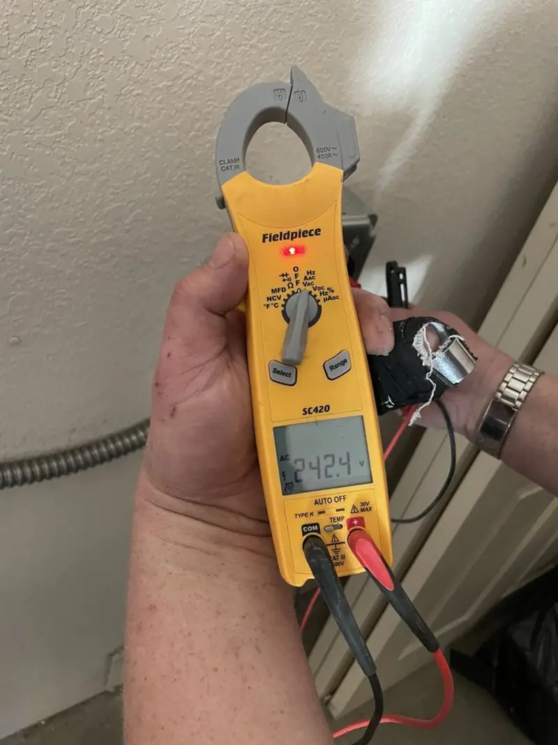 Voltage testing with clamp meter during Circuit Breaker Repair in Waconia